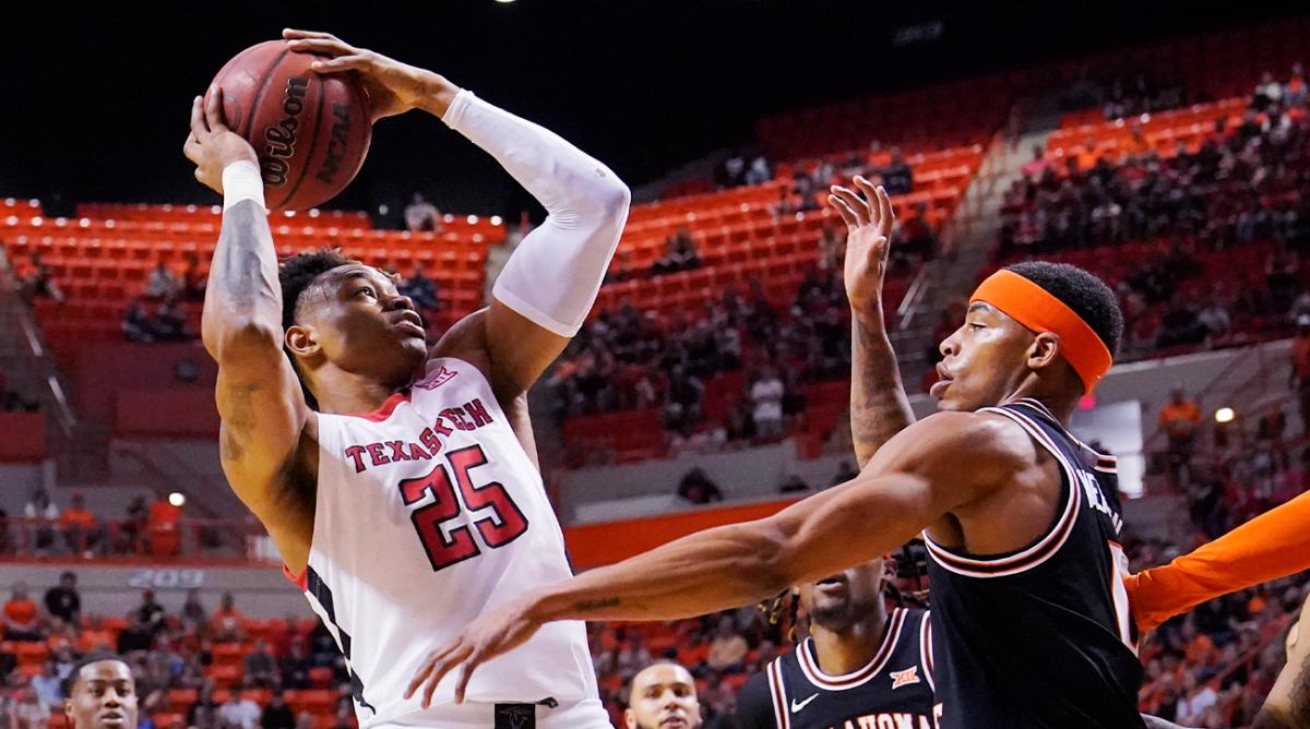 Texas Tech guard Adonis Arms (25) goes the the basket in front of Oklahoma State guard Avery Anderson III (0) in the first half of an NCAA college basketball game Saturday, March 5, 2022, in Stillwater, Okla.