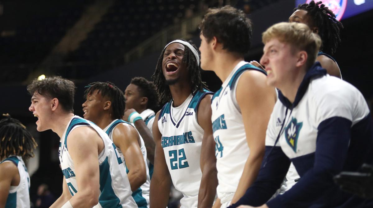 The UNCW bench reacts as the Seahawks move toward their 60-57 win against Charleston in a CAA tournament semifinal at the Entertainment & Sports Arena in Washington, D.C., Monday, March 7, 2022.