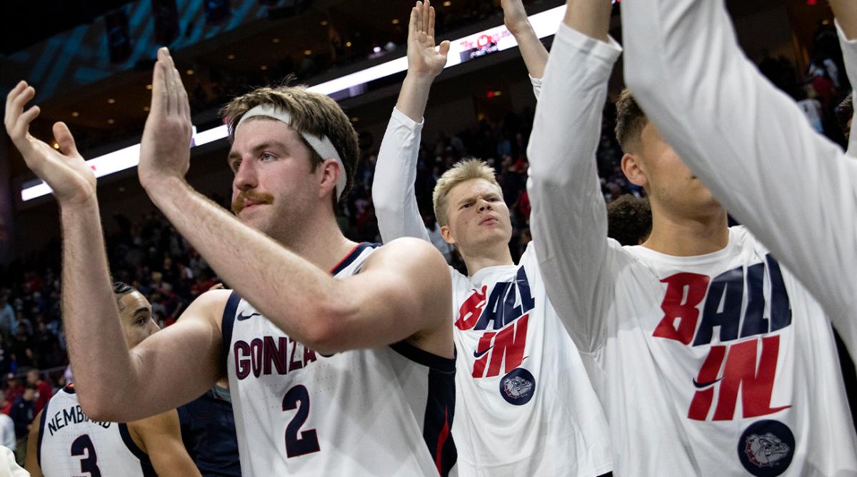 Gonzaga forward Drew Timme, left, celebrates with team members after defeating San Francisco in an NCAA semifinal college basketball game at the West Coast Conference tournament Monday, March 7, 2022, in Las Vegas.