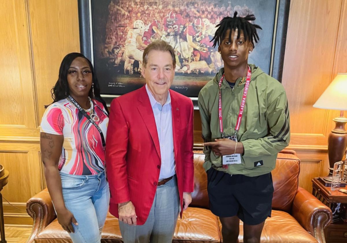 Class of 2023 cornerback Cormani McClain, right, and his mother, Kaishay, left, meet with Nick Saban.