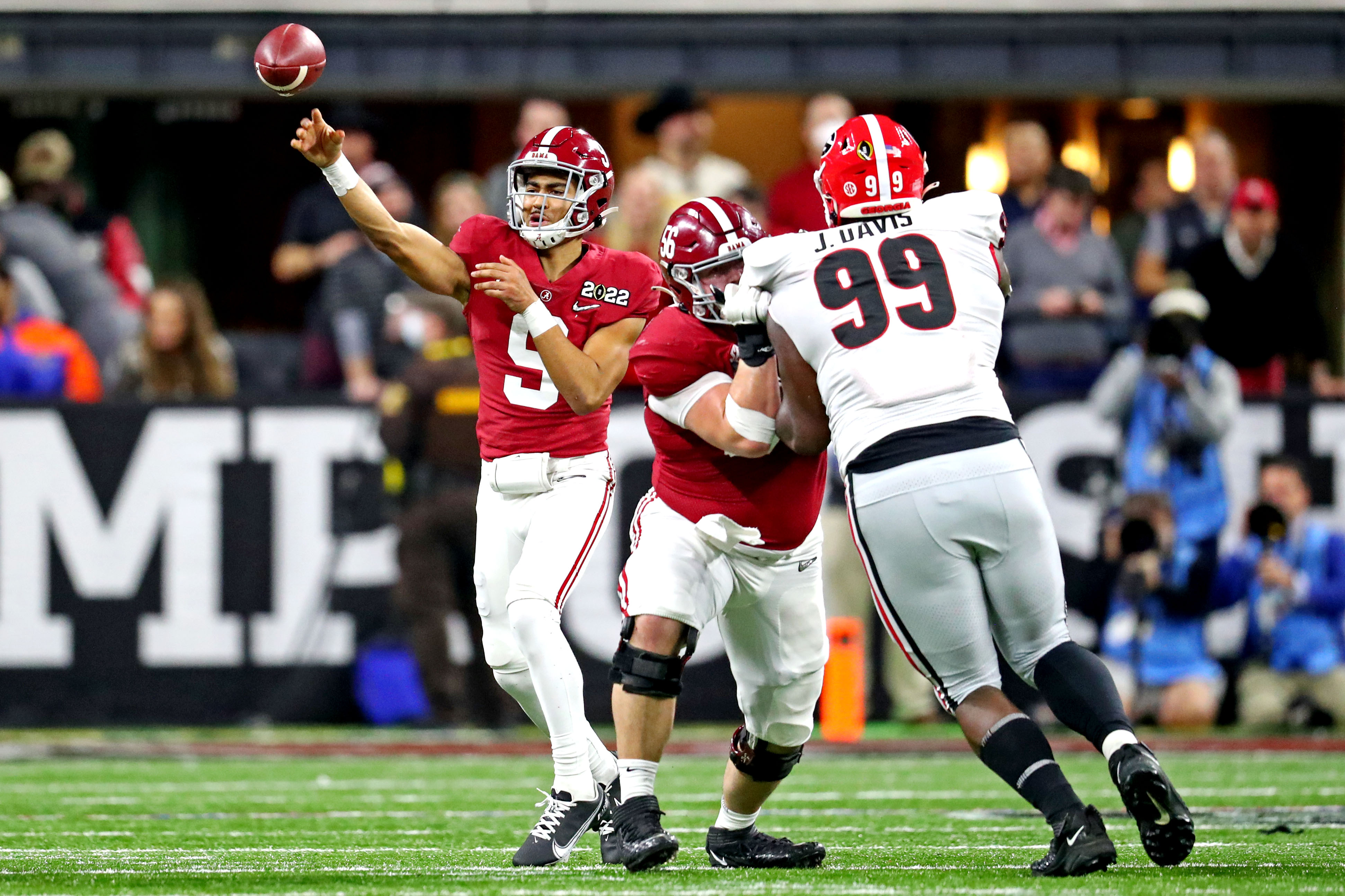Jan 10, 2022; Indianapolis, IN, USA; Alabama Crimson Tide quarterback Bryce Young (9) throws a pass during the fourth quarter against Georgia Bulldogs defensive lineman Jordan Davis (99) in the 2022 CFP college football national championship game at Lucas Oil Stadium. Mandatory Credit: Mark J. Rebilas-USA TODAY Sports