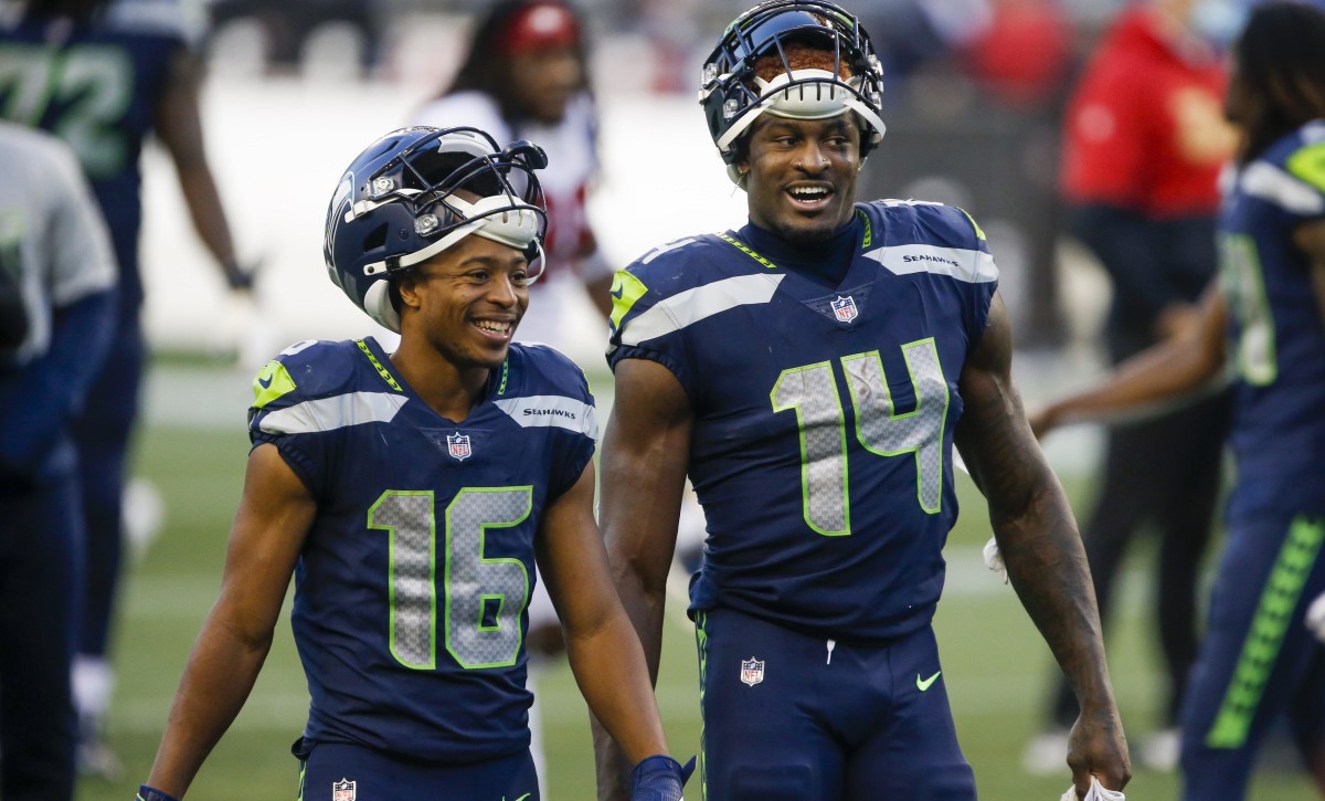 Nov 1, 2020; Seattle, Washington, USA; Seattle Seahawks wide receiver Tyler Lockett (16) and wide receiver DK Metcalf (14) return to the locker room following a 37-27 victory against the San Francisco 49ers at CenturyLink Field.