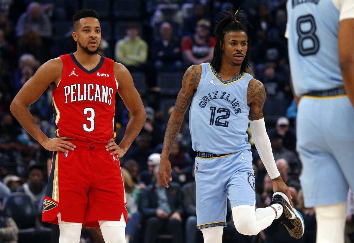 Mar 8, 2022; Memphis, Tennessee, USA; J McCollum (3) and Memphis Grizzlies guard Ja Morant (12)