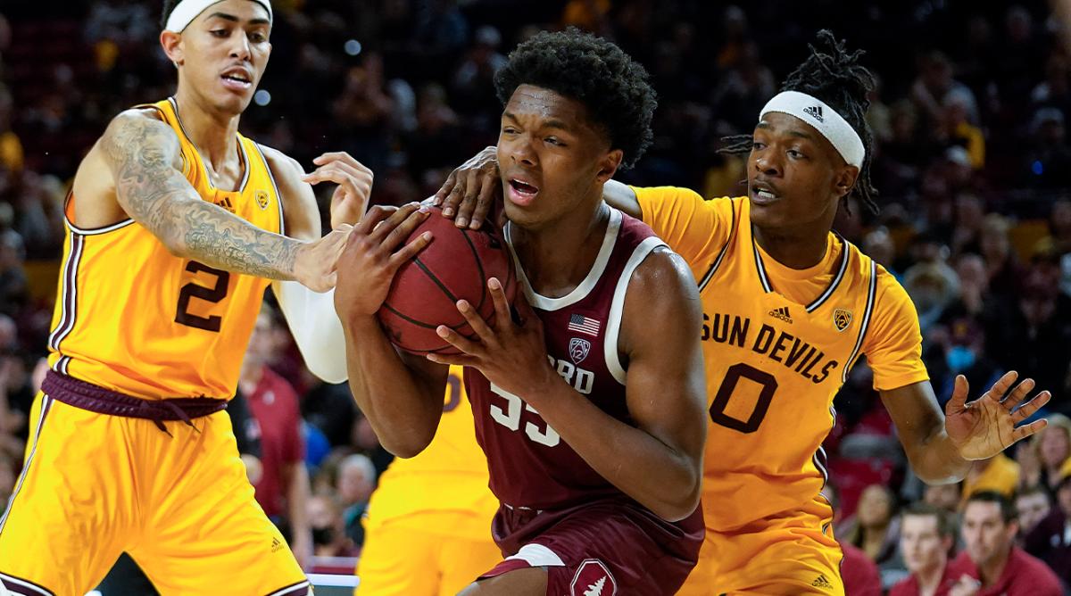 Stanford’s Harrison Ingram (55) gets double-teamed by Arizona State’s Jalen Graham (2) and DJ Horne (0) during the second half of an NCAA college basketball game, Saturday, March 5, 2022, in Tempe, Ariz.