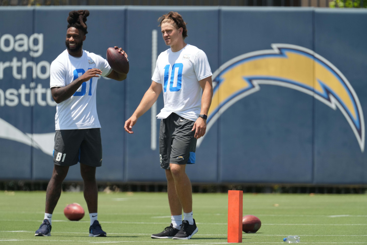 Jun 1, 2021; Costa Mesa, CA, USA; Los Angeles Chargers receiver Mike Williams (81) and quarterback Justin Herbert (10) during organized team activities at Hoag Performance Center. Mandatory Credit: Kirby Lee-USA TODAY Sports