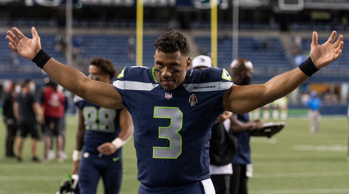 FILE - Seattle Seahawks quarterback Russell Wilson gestures as he walks off the field after an NFL preseason football game against the Los Angeles Chargers, Saturday, Aug. 28, 2021, in Seattle. The Seahawks won 27-0. The Seattle Seahawks have agreed to trade nine-time Pro Bowl quarterback Russell Wilson to the Denver Broncos for a massive haul of draft picks and players, two people familiar with the negotiations confirmed to The Associated Press on Tuesday, March 8, 2022. The people spoke on condition of anonymity because the blockbuster trade, which is pending Wilson passing a physical, can’t become official until the start of the new league year on March 16.