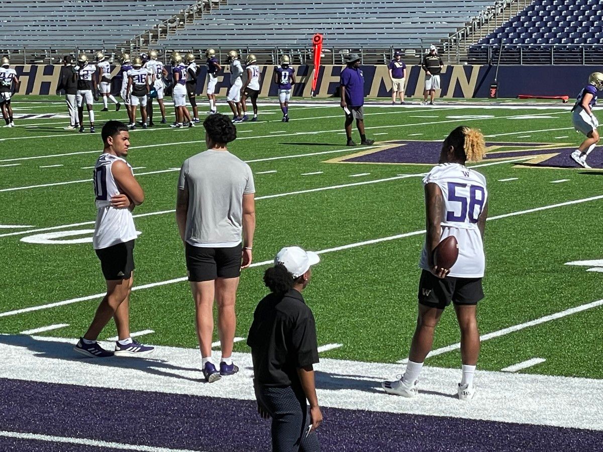 Alphonzo Tuputala, Laiatu Latu and Zion Tupuola-Fetui watch fall practice.