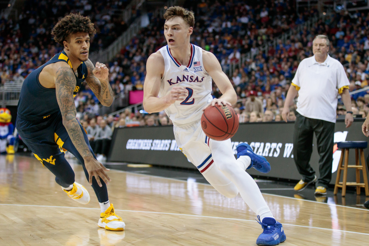 Mar 10, 2022; Kansas City, MO, USA; Kansas Jayhawks guard Christian Braun (2) drives to the basket during the first half against the West Virginia Mountaineers at T-Mobile Center. Mandatory Credit: William Purnell-USA TODAY Sports
