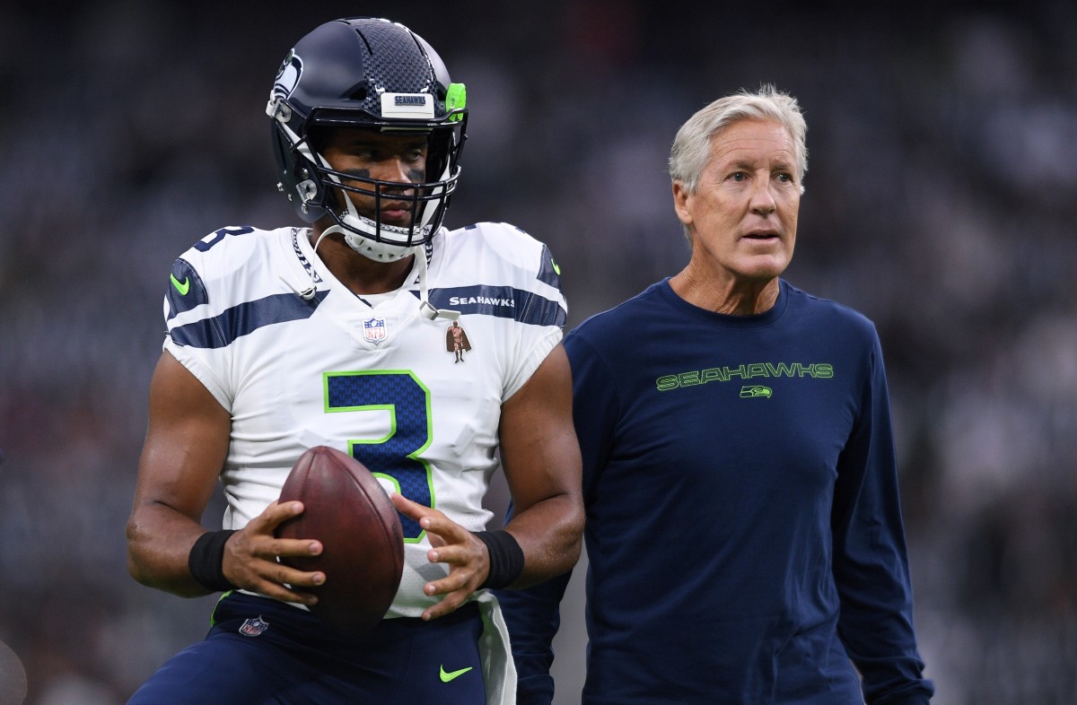 Seattle Seahawks quarterback Russell Wilson (3) and manager Pete Carroll (right) look on before the game against the Las Vegas Raiders at Allegiant Stadium.
