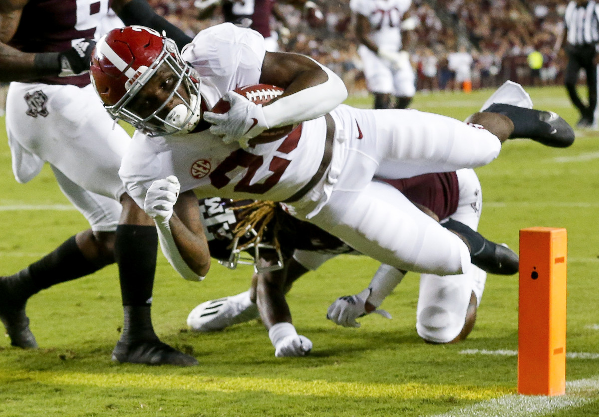 Alabama running back Roydell Williams (23) scores a touchdown against Texas A&M at Kyle Field.