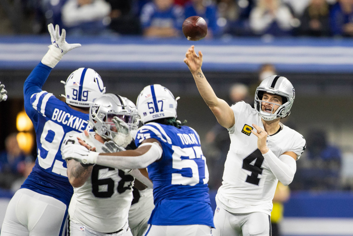 Jan 2, 2022; Indianapolis, Indiana, USA; Las Vegas Raiders quarterback Derek Carr (4) passes the ball in the second half against the Indianapolis Colts at Lucas Oil Stadium.