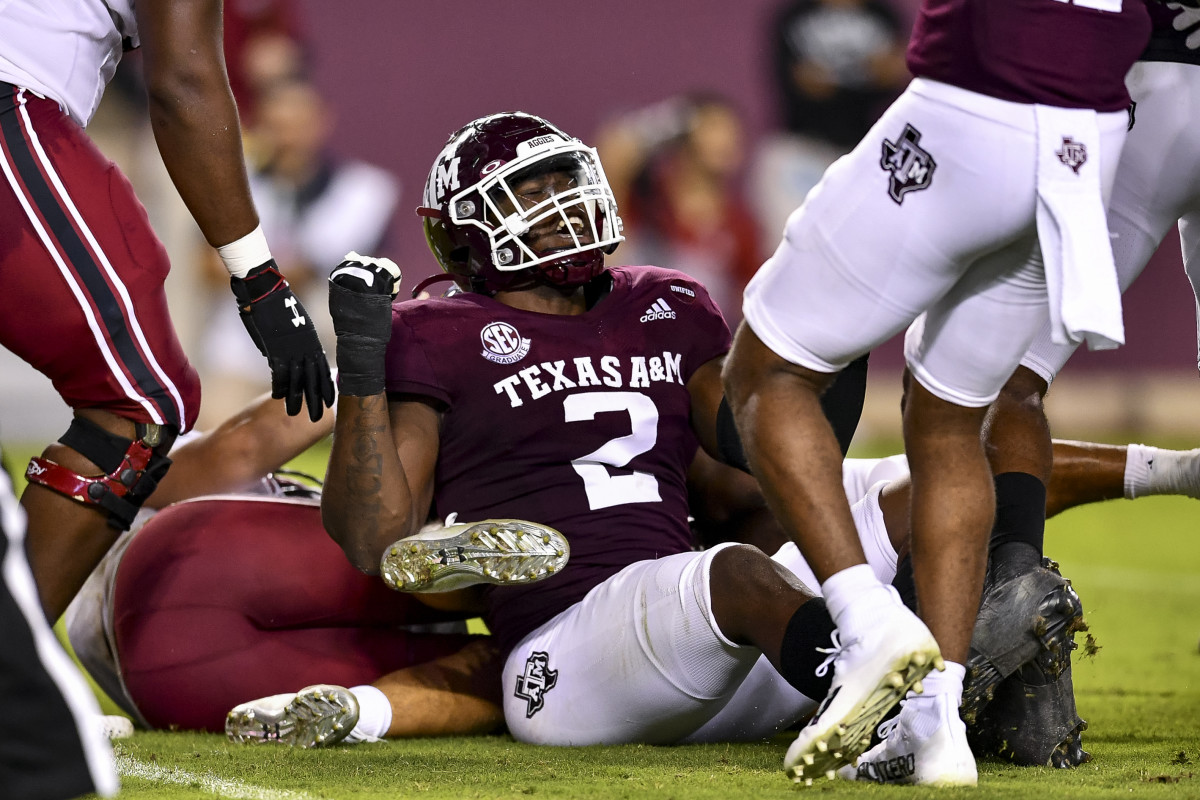Oct 23, 2021; College Station, Texas, USA; Texas A&M Aggies defensive lineman Micheal Clemons (2) reacts to linebacker Aaron Hansford (1) fumble recovery during the second quarter against the South Carolina Gamecocks at Kyle Field. Mandatory Credit: Maria Lysaker-USA TODAY Sports