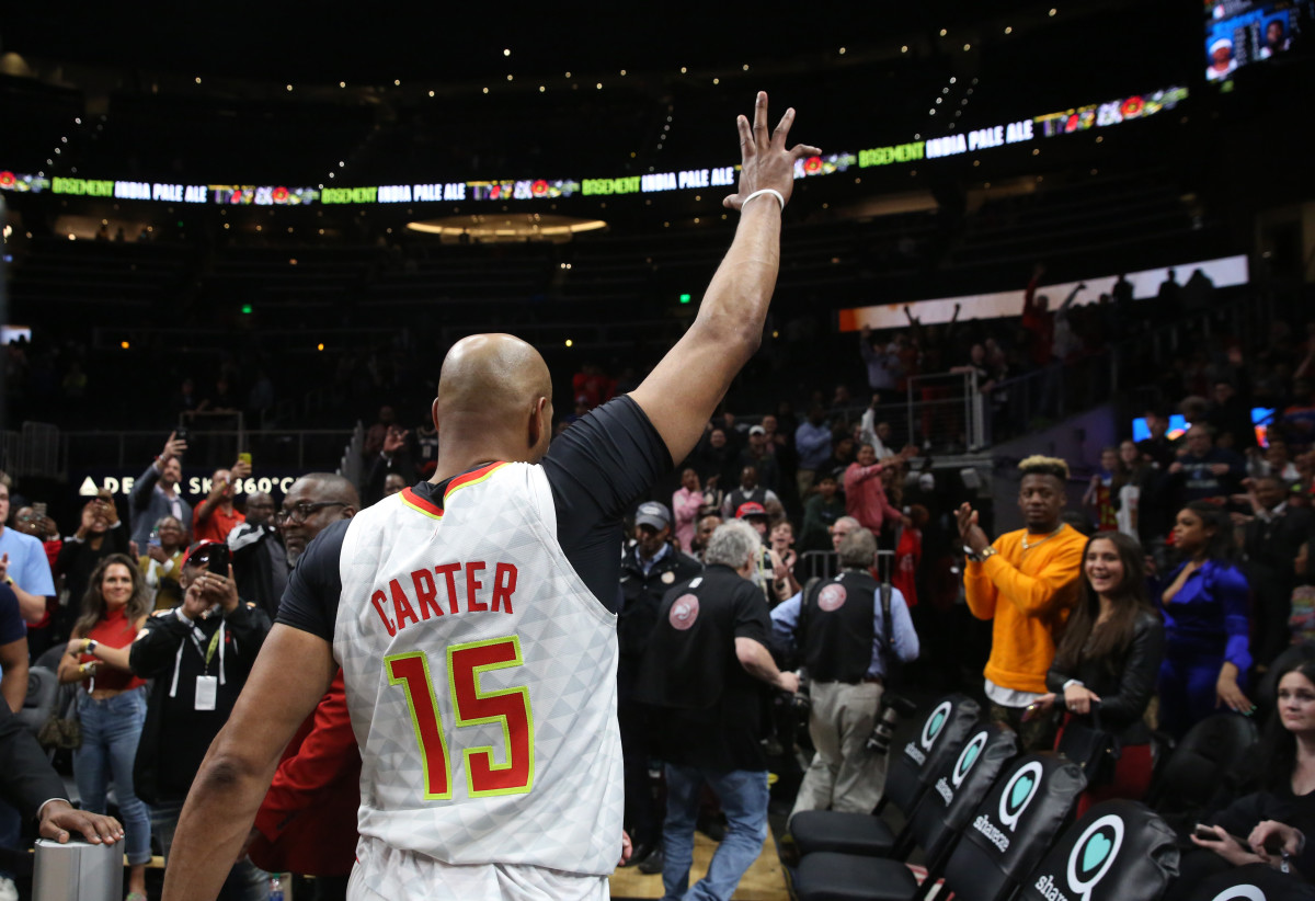 Mar 11, 2020; Atlanta, Georgia, USA; Atlanta Hawks guard Vince Carter (15) waves to fans after an overtime loss to the New York Knicks at State Farm Arena.