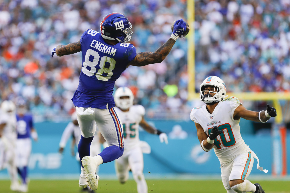 Dec 5, 2021; Miami Gardens, Florida, USA; New York Giants tight end Evan Engram (88) attempts a one-handed catch against Miami Dolphins free safety Nik Needham (40) during the second half at Hard Rock Stadium. Mandatory Credit: Sam Navarro-USA TODAY Sports