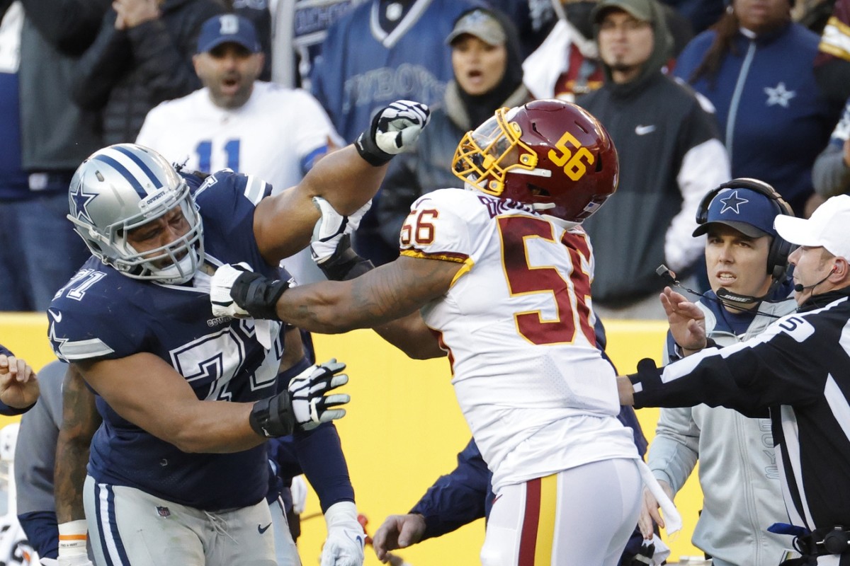Dec 12, 2021; Landover, Maryland, USA; Dallas Cowboys offensive tackle La'el Collins (71) gets into an altercation with Washington Football Team defensive end Will Bradley-King (56) after his hit on Cowboys quarterback Dak Prescott (not pictured) during the fourth quarter at FedExField. Mandatory Credit: Geoff Burke-USA TODAY Sports
