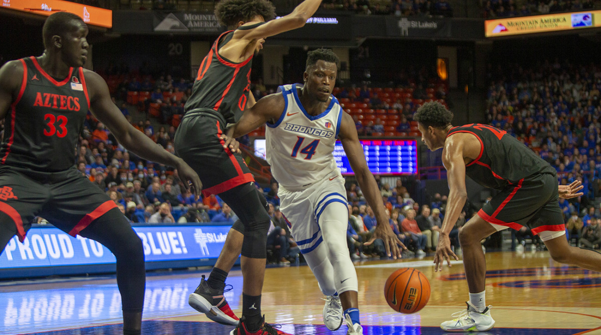 Feb 22, 2022; Boise, Idaho, USA; Boise State Broncos guard Emmanuel Akot (14) moves to the basket during second half action against the San Diego State Aztecs at ExtraMile Arena.