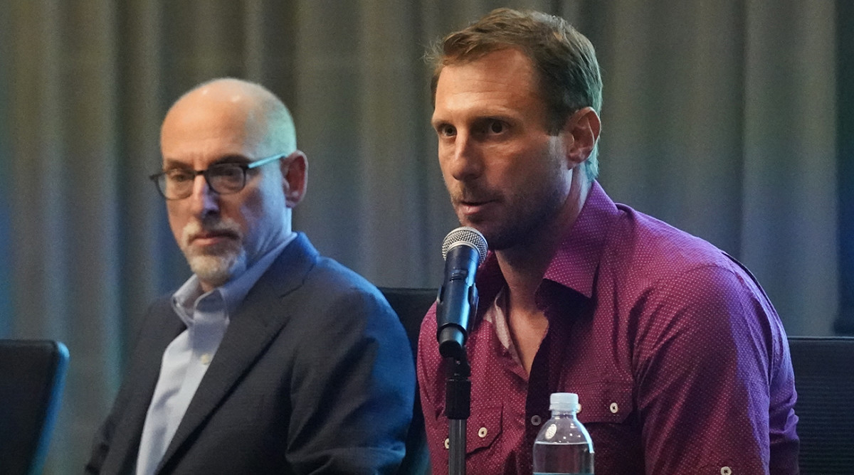 New York Mets pitcher Max Scherzer, right, speaks as Bruce Meyer, chief union negotiator, listens during a news conference Tuesday, March 1, 2022, in Jupiter, Fla.