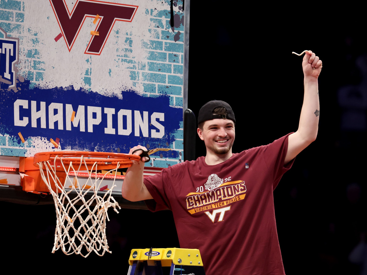 Virginia Tech Hokies guard Hunter Cattoor (0) cuts down the net after defeating the Duke Blue Devils 82-67 in the ACC Men’s Basketball Tournament final at Barclays Center.