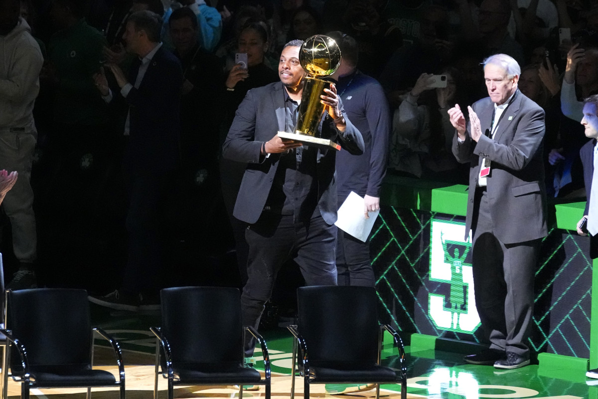 Paul Pierce is introduced during Basketball Hall of Famer and former Boston Celtic Kevin Garnett s number retirement ceremony with the 2008 NBA World Championship Trophy after game between the Boston Celtics and the Dallas Mavericks at TD Garden.