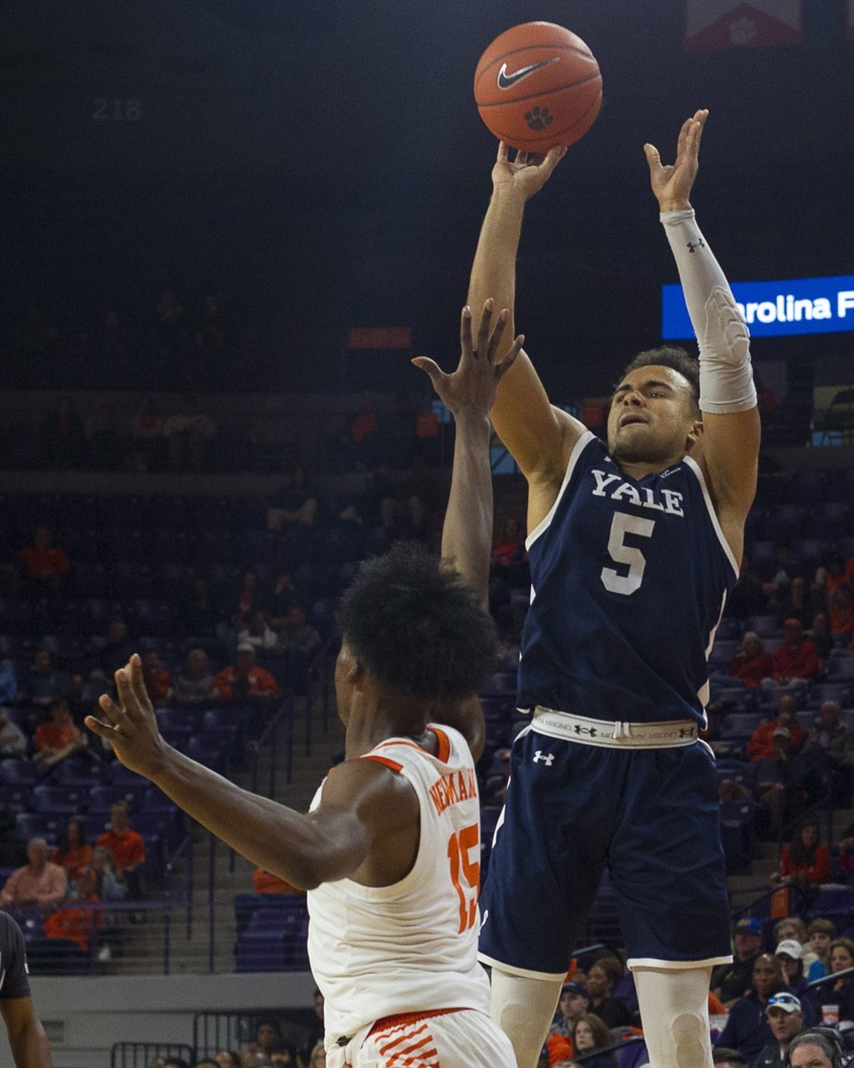 Dec 22, 2019; Clemson, South Carolina, USA; Yale Bulldogs guard Azar Swain (5) shoots the ball while being defended by Clemson Tigers guard John Newman (15) during the first half of the game at Littlejohn Coliseum.