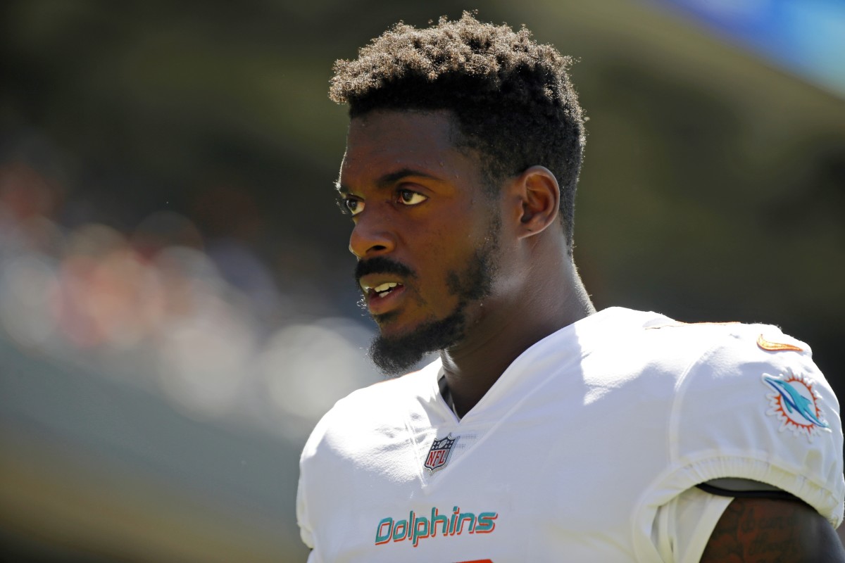 Aug 14, 2021; Chicago, Illinois, USA; Miami Dolphins wide receiver Robert Foster (16) walks off the field after warmups before the game against the Chicago Bears at Soldier Field.