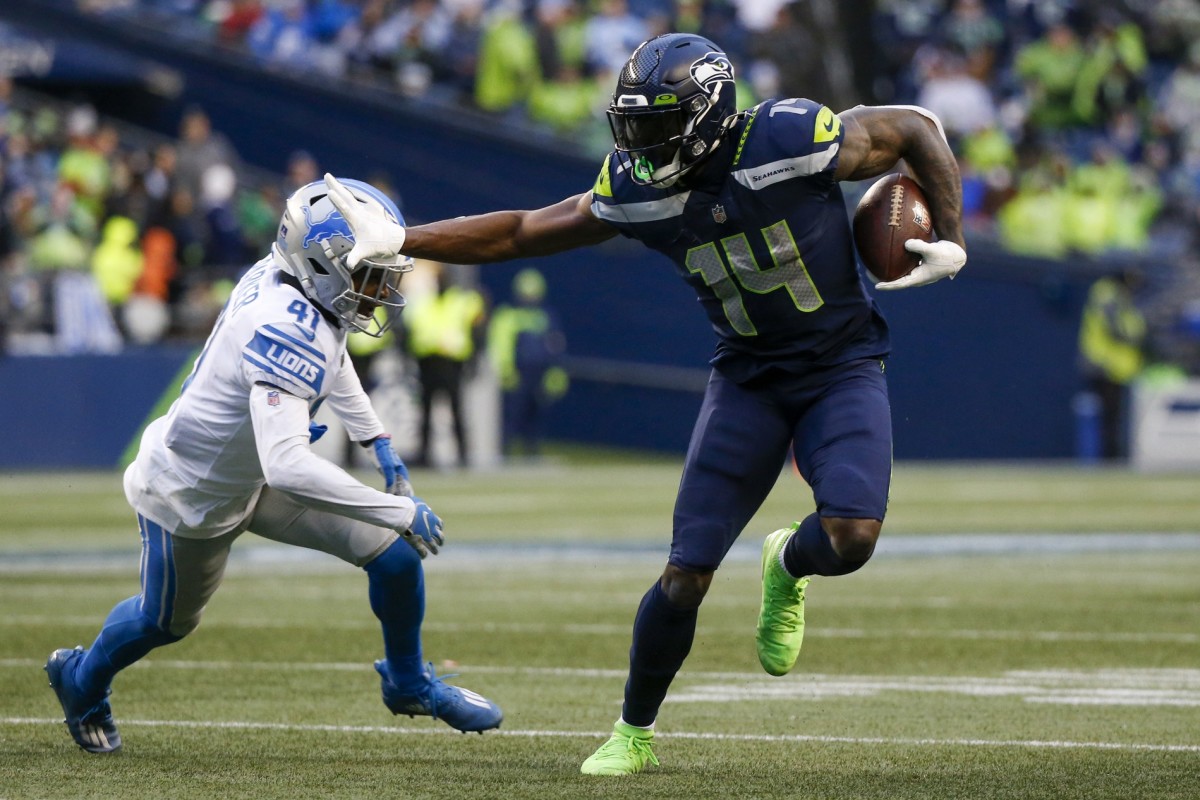 Seattle Seahawks WR D.K. Metcalf uses stiff arm