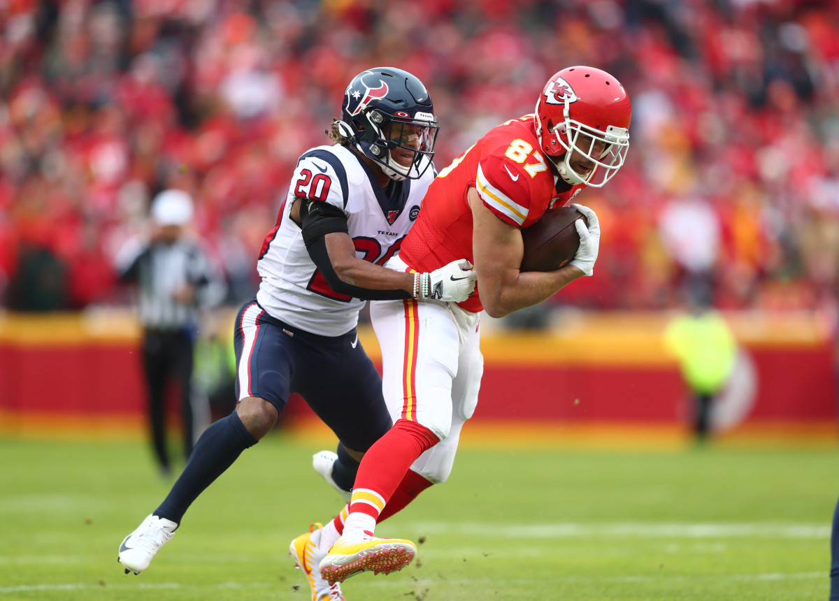 Jan 12, 2020; Kansas City, Missouri, USA; Kansas City Chiefs tight end Travis Kelce (87) is tackled by Houston Texans safety Justin Reid (20) in the AFC Divisional Round playoff football game at Arrowhead Stadium. Mandatory Credit: Mark J. Rebilas-USA TODAY Sports