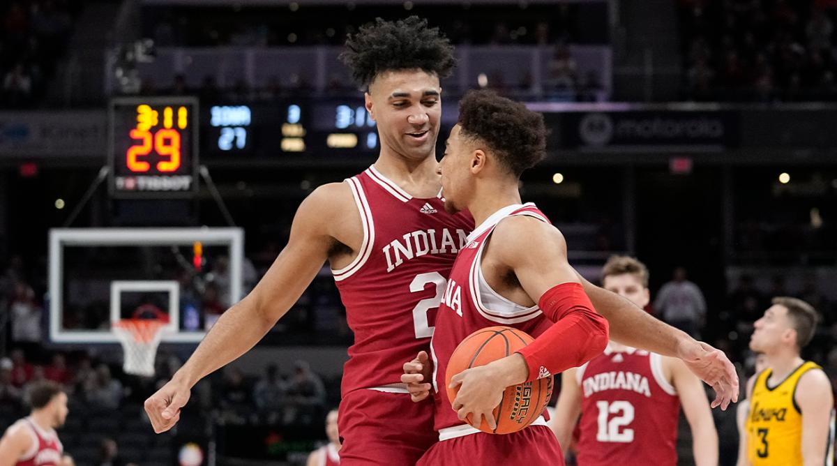 Indiana’s Trayce Jackson-Davis (23) reacts with Rob Phinisee during the first half of an NCAA college basketball game against Iowa in the semifinal round at the Big Ten Conference tournament, Saturday, March 12, 2022, in Indianapolis.
