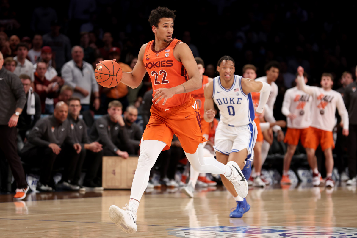 Mar 12, 2022; Brooklyn, NY, USA; Virginia Tech Hokies forward Keve Aluma (22) brings the ball up court against Duke Blue Devils forward Wendell Moore Jr. (0) during the first half of the ACC Men's Basketball Tournament final at Barclays Center. Mandatory Credit: Brad Penner-USA TODAY Sports
