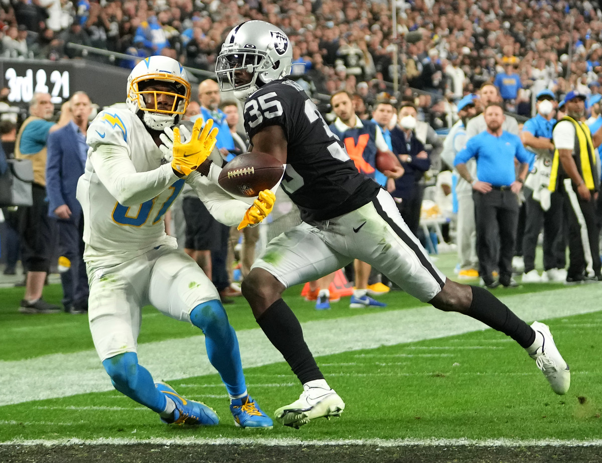Jan 9, 2022; Paradise, Nevada, USA; Las Vegas Raiders cornerback Brandon Facyson (35) breaks up a pass intended for Los Angeles Chargers wide receiver Mike Williams (81) at Allegiant Stadium. Mandatory Credit: Stephen R. Sylvanie-USA TODAY Sports