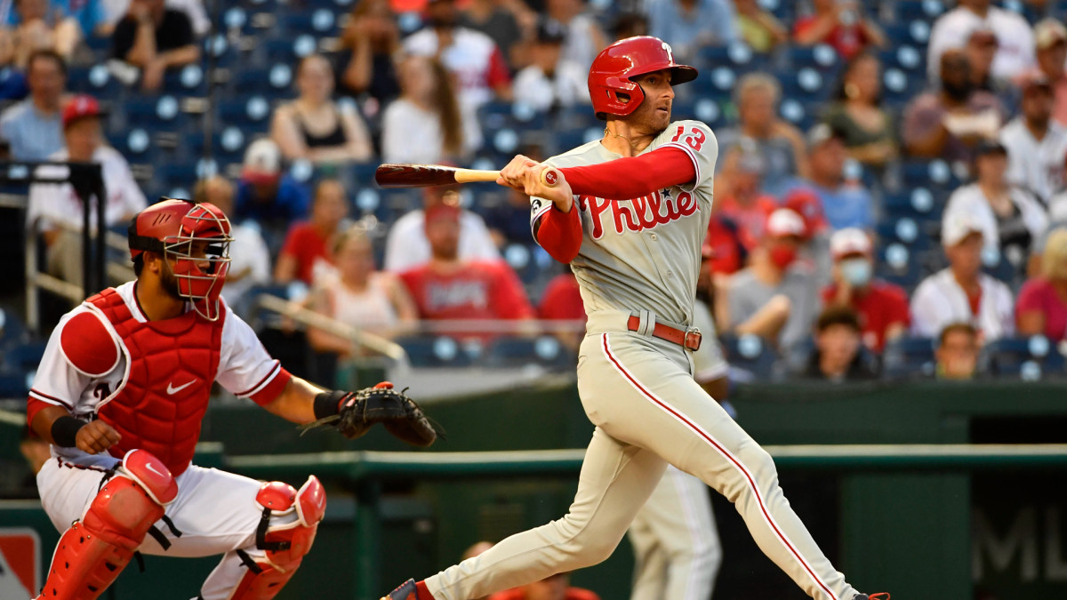 Aug 30, 2021; Washington, District of Columbia, USA; Philadelphia Phillies third baseman Brad Miller (13) hits a single against the Washington Nationals during the first inning at Nationals Park. Mandatory Credit: Brad Mills-USA TODAY Sports