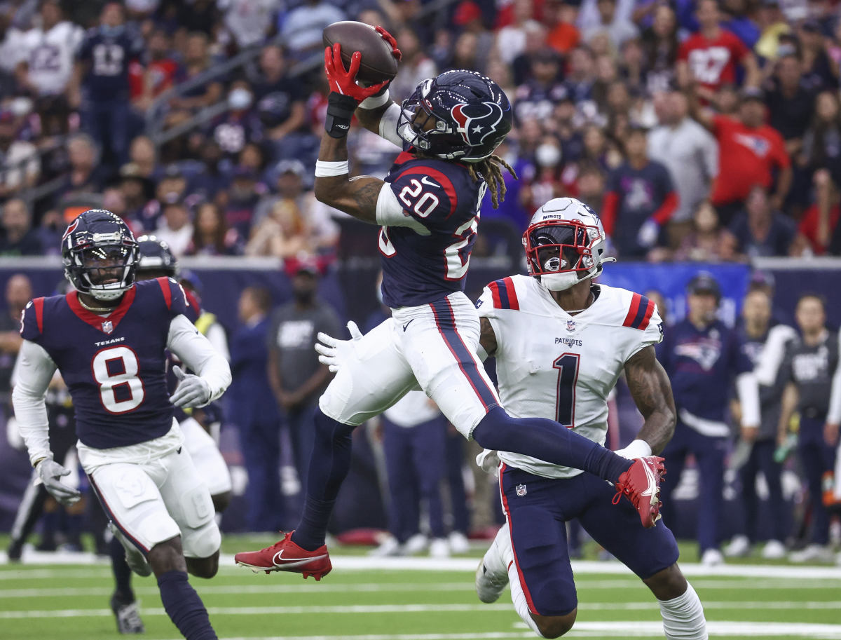 Oct 10, 2021; Houston, Texas, USA; Houston Texans safety Justin Reid (20) attempts to intercept a pass intended for New England Patriots wide receiver N Keal Harry (1) during the fourth quarter at NRG Stadium. Mandatory Credit: Troy Taormina-USA TODAY Sports
