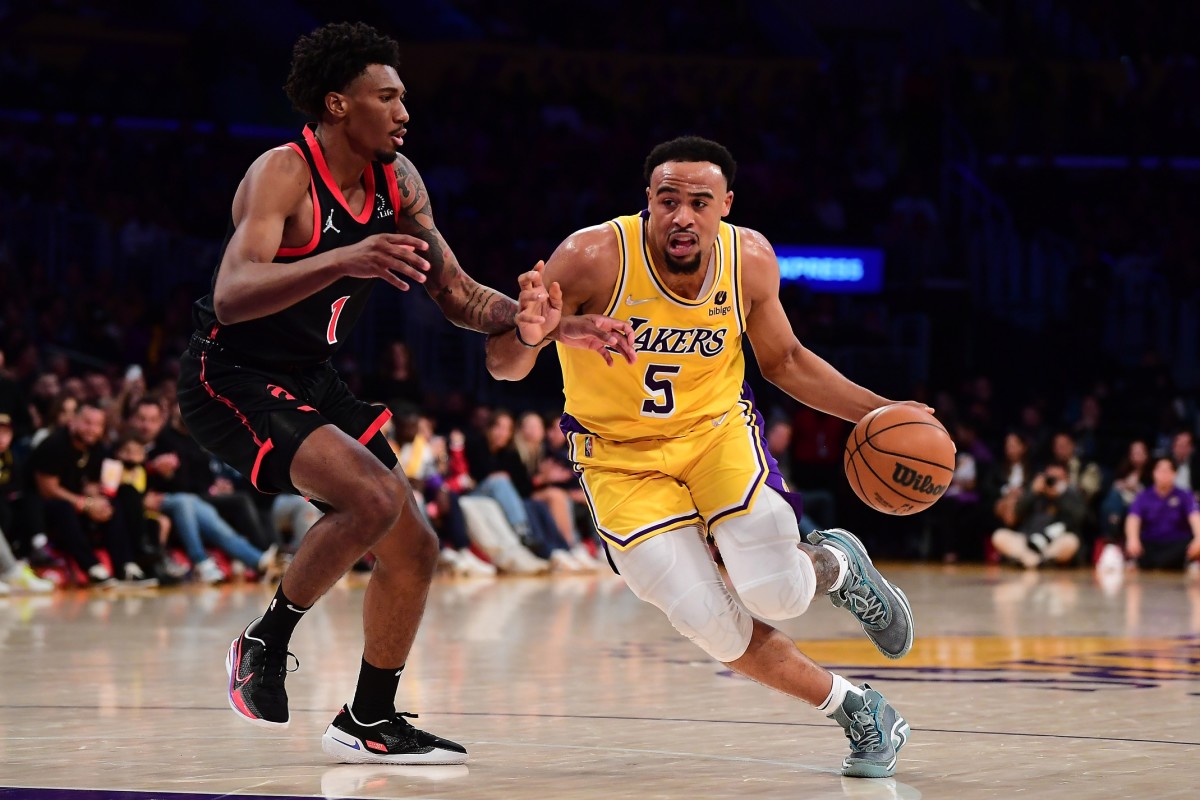 Los Angeles Lakers guard Talen Horton-Tucker (5) moves the ball against Toronto Raptors guard Armoni Brooks (1) during the second half at Crypto.com Arena