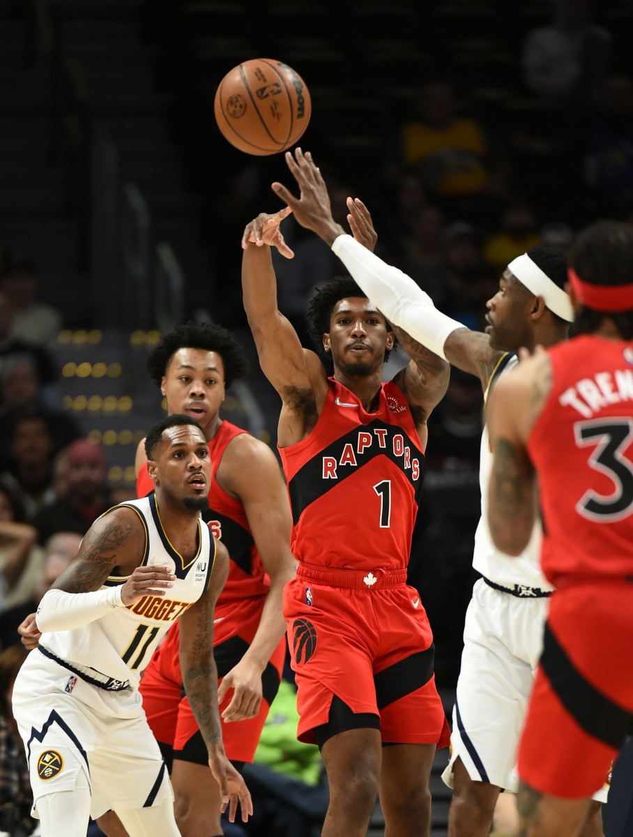 Toronto Raptors guard Armoni Brooks (1) throws a pass over Denver Nuggets forward Will Barton (5) out to Toronto Raptors guard Gary Trent Jr. during the first quarter at Ball Arena