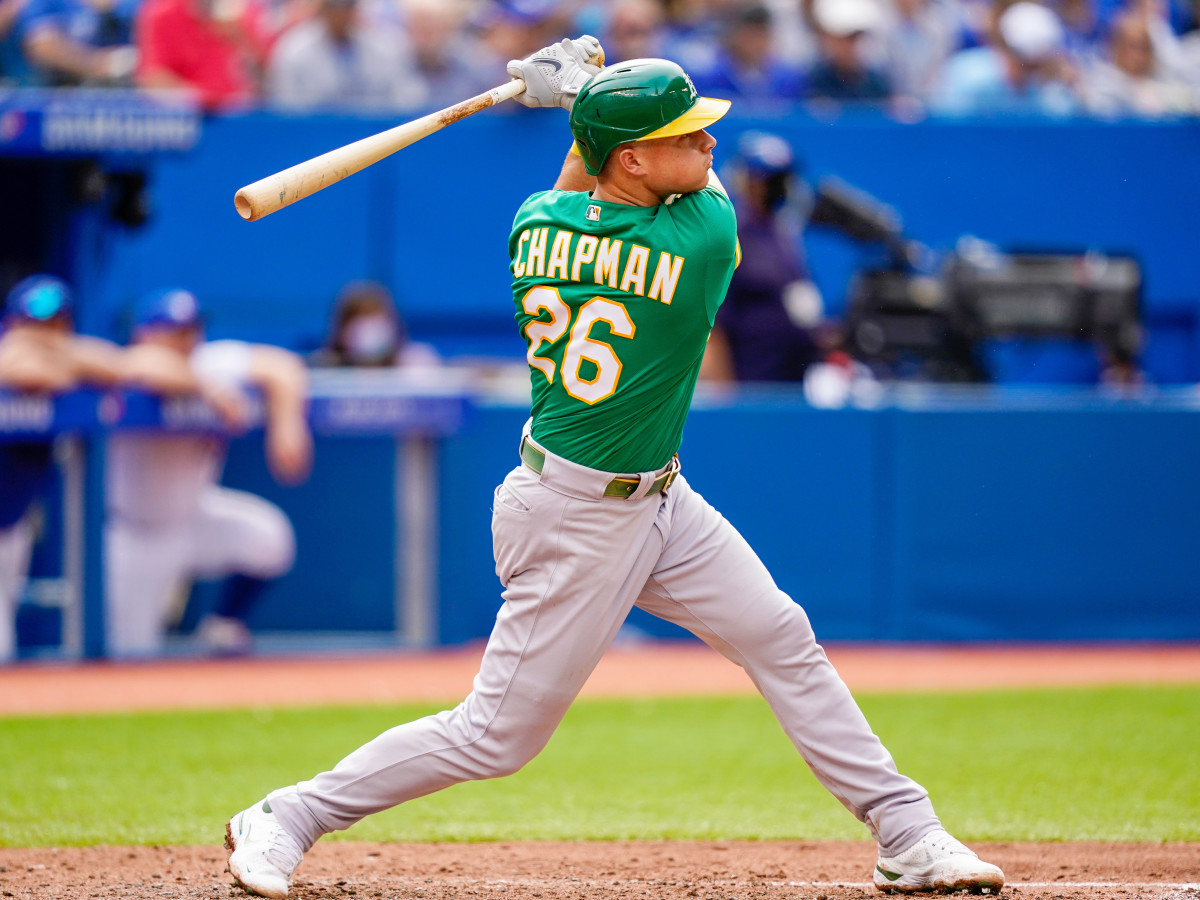 Sep 4, 2021; Toronto, Ontario, CAN; Oakland Athletics third baseman Matt Chapman (26) hits a home run against the Toronto Blue Jays during the fifth inning at Rogers Centre.