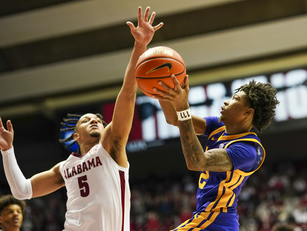 LSU Tigers guard Eric Gaines (2) goes to the basket against Alabama Crimson Tide guard Jaden Shackelford (5) during the first half at Coleman Coliseum.