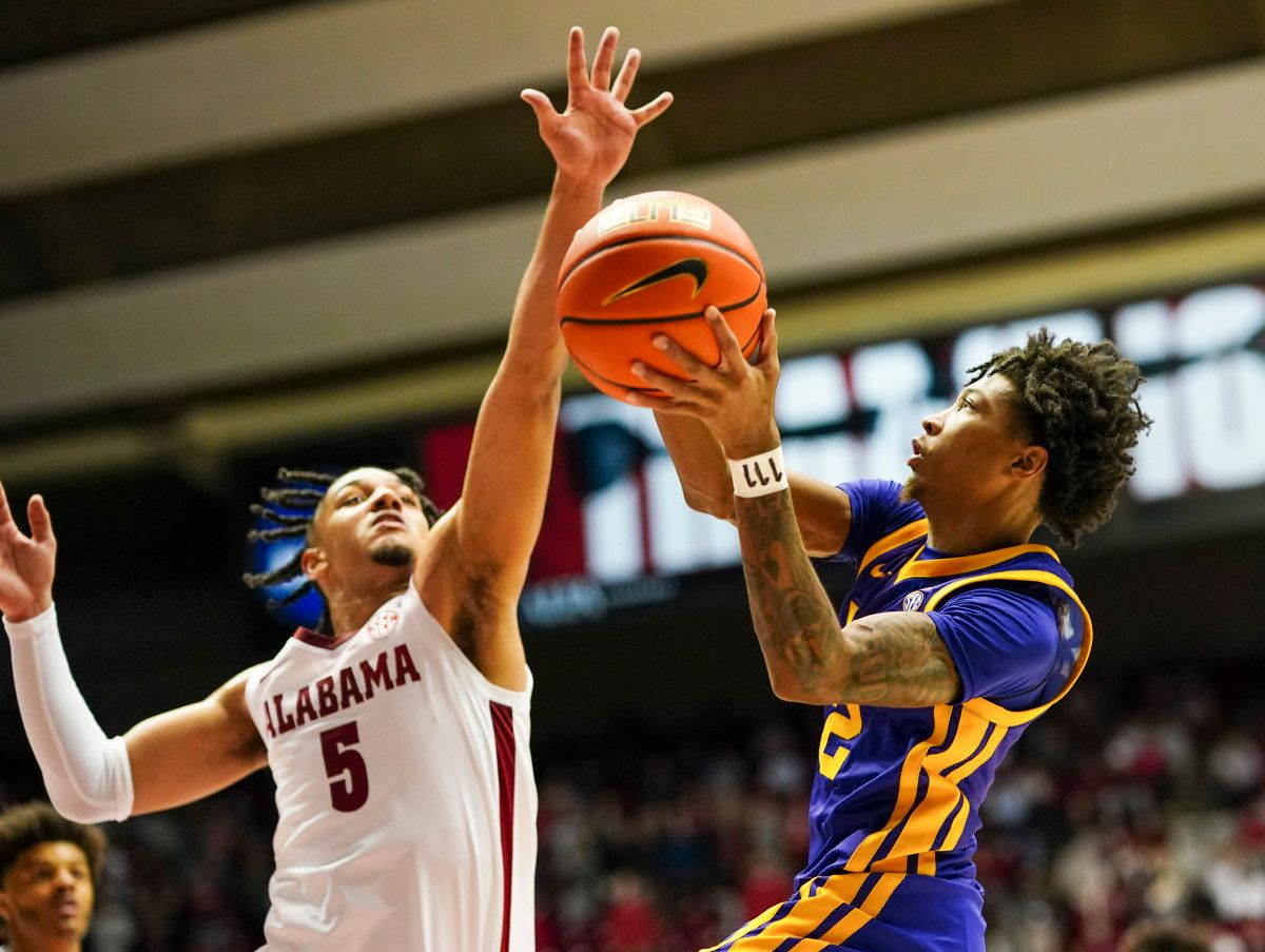 LSU Tigers guard Eric Gaines (2) goes to the basket against Alabama Crimson Tide guard Jaden Shackelford (5) during the first half at Coleman Coliseum.