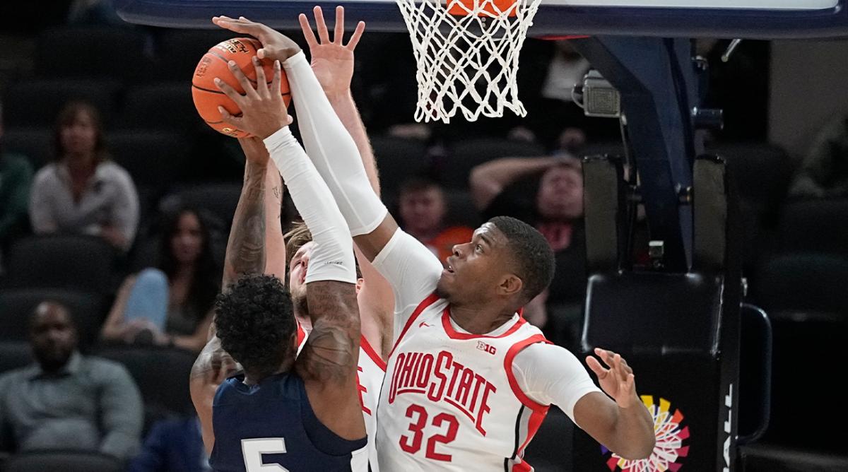 Penn State’s Greg Lee (5) has his shot blocked by Ohio State’s E.J. Liddell (32) during the first half of an NCAA college basketball game at the Big Ten Conference tournament, Thursday, March 10, 2022, in Indianapolis.