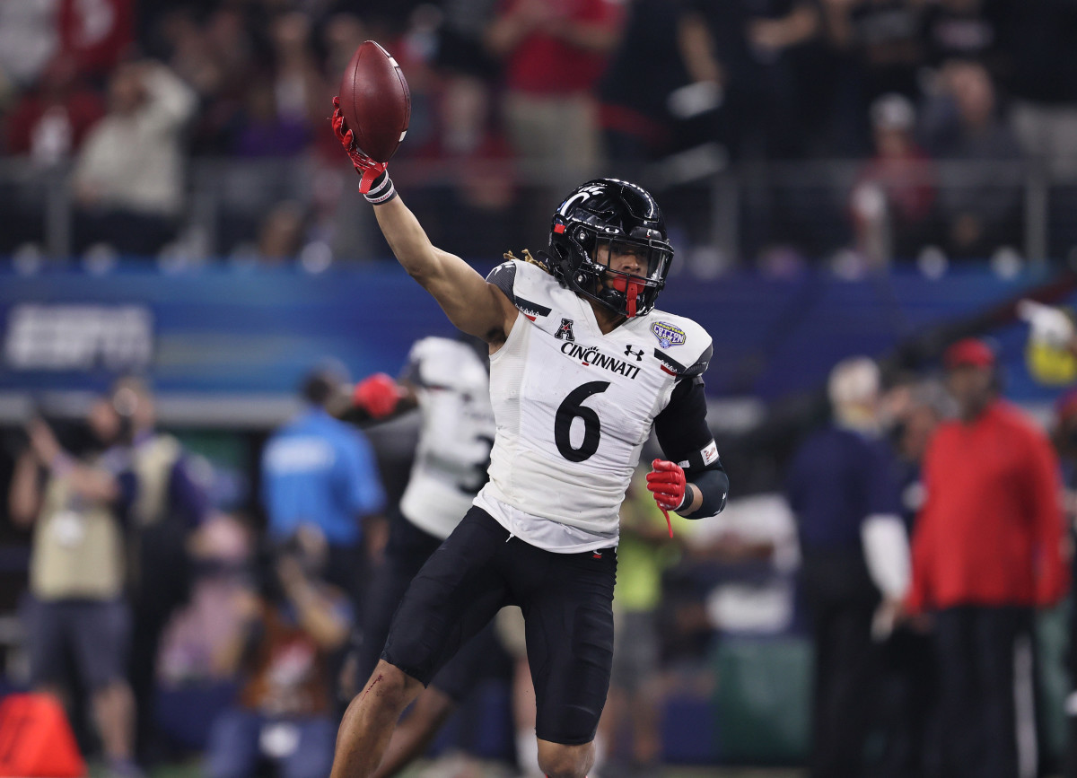 Dec 31, 2021; Arlington, Texas, USA; Cincinnati Bearcats safety Bryan Cook (6) celebrates an interception in the third quarter against the Alabama Crimson Tide during the 2021 Cotton Bowl college football CFP national semifinal game at AT&T Stadium. Mandatory Credit: Matthew Emmons-USA TODAY Sports