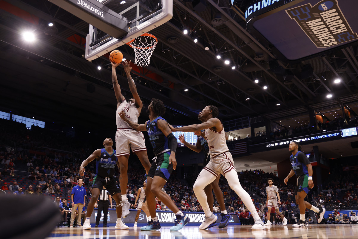 Mar 15, 2022; Dayton, OH, USA; Texas Southern Tigers forward Brison Gresham (44) goes to the basket pressured by Texas A&M-CC Islanders forward San Antonio Brinson (23) in the first half during the First Four of the 2022 NCAA Tournament at UD Arena. Mandatory Credit: Rick Osentoski-USA TODAY Sports