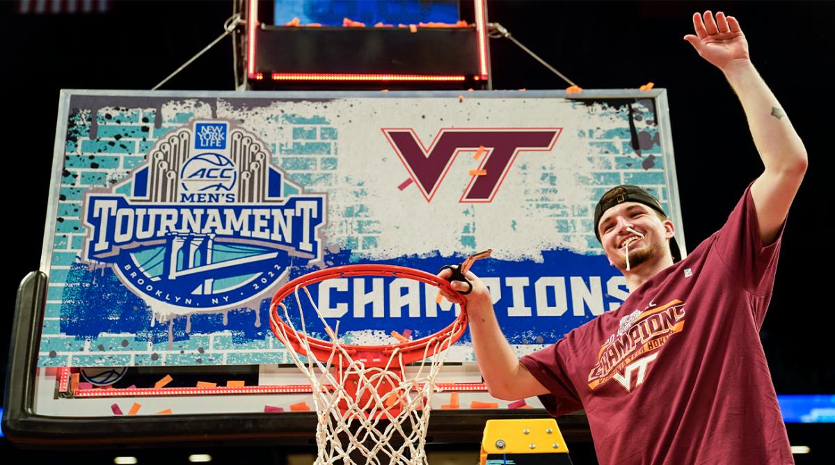 Virginia Tech’s Hunter Cattoor, tournament most valuable player, celebrates with a piece of the game net after winning the NCAA college basketball championship game against Duke in the Atlantic Coast Conference men’s tournament, Saturday, March 12, 2022, in New York. Virginia Tech won, 82-67.