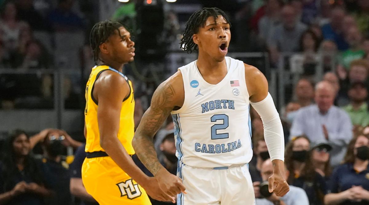 North Carolina guard Caleb Love (2) reacts to scoring, in front of Marquette forward Justin Lewis during the first half of a college basketball game in the first round of the NCAA men’s tournament in Fort Worth, Texas, Thursday, March 17, 2022.