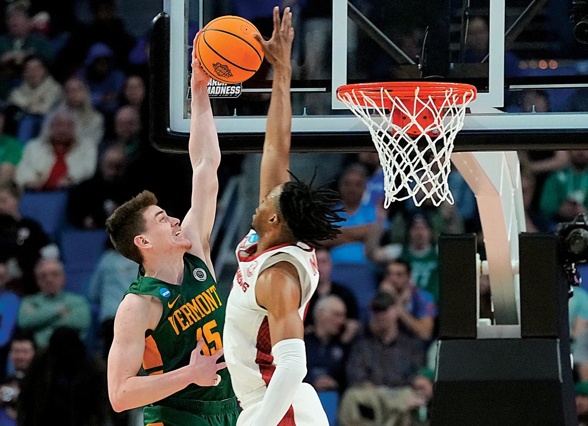 Vermont Catamounts guard Finn Sullivan (15) shoots against Arkansas Razorbacks guard Stanley Umude (0) in the first half during the first round of the 2022 NCAA Tournament at KeyBank Center.