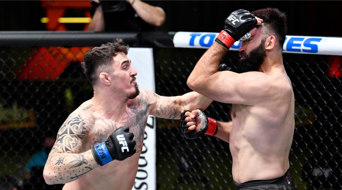 Feb 20, 2021; Las Vegas, NV, USA; Tom Aspinall of England punches Andrei Arlovski of Belarus in a heavyweight bout during the UFC Fight Night event at UFC APEX on February 20, 2021 in Las Vegas, Nevada.