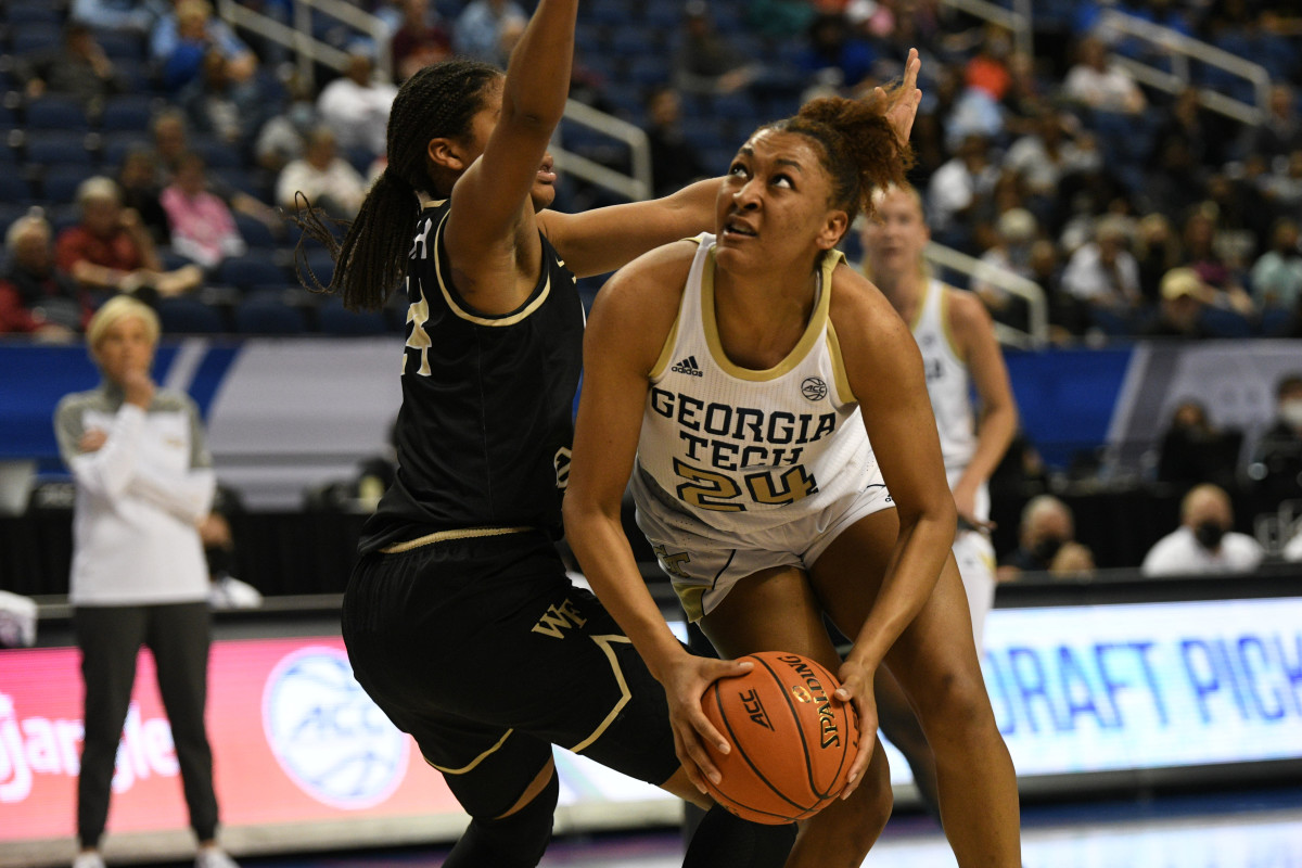 Mar 3, 2022; Greensboro, North Carolina, USA; Georgia Tech Yellow Jackets guard Eylia Love (24) makes a move underneath against Wake Forest Demon Deacons guard Jewel Spear (24) during the fourth quarter at Greensboro Coliseum Complex. Mandatory Credit: William Howard-USA TODAY Sports