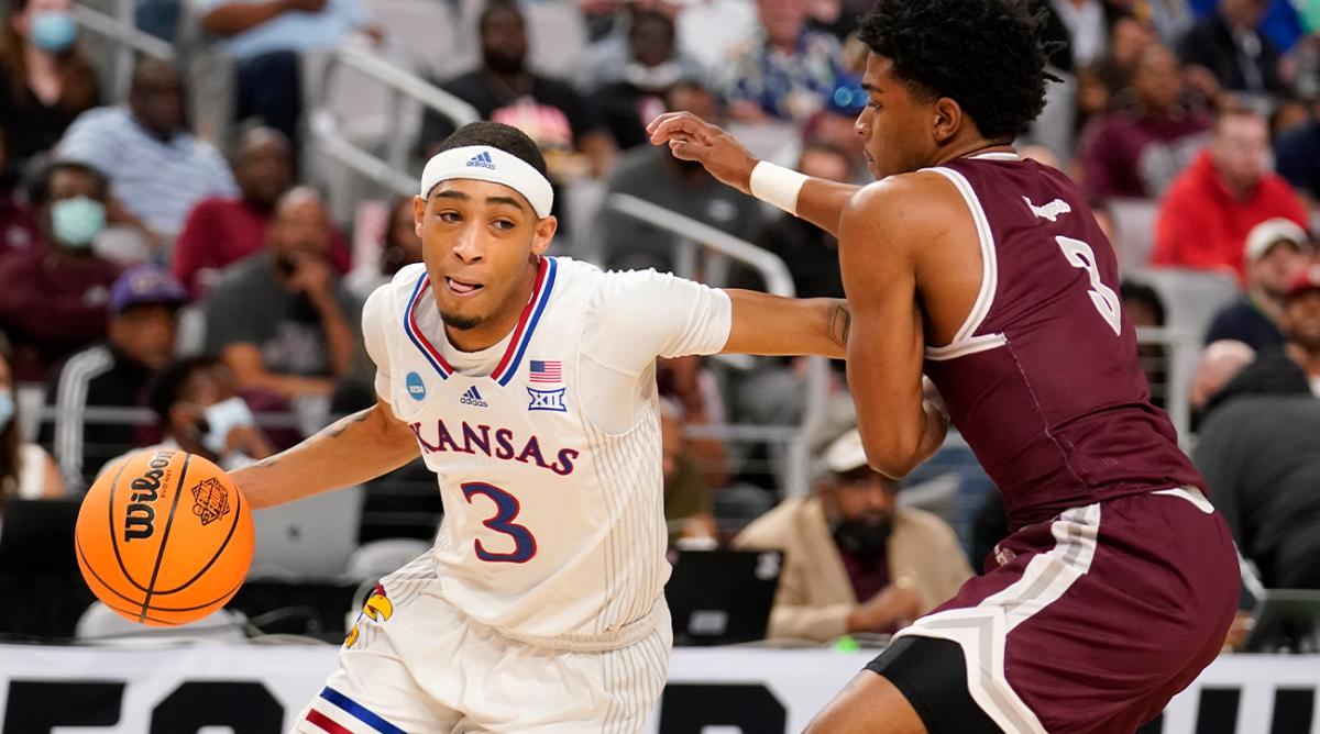 Kansas guard Dajuan Harris Jr. (3) works against Texas Southern guard PJ Henry, right, in the first half of a first-round game in the NCAA college basketball tournament in Fort Worth, Texas, Thursday, March 17, 2022.