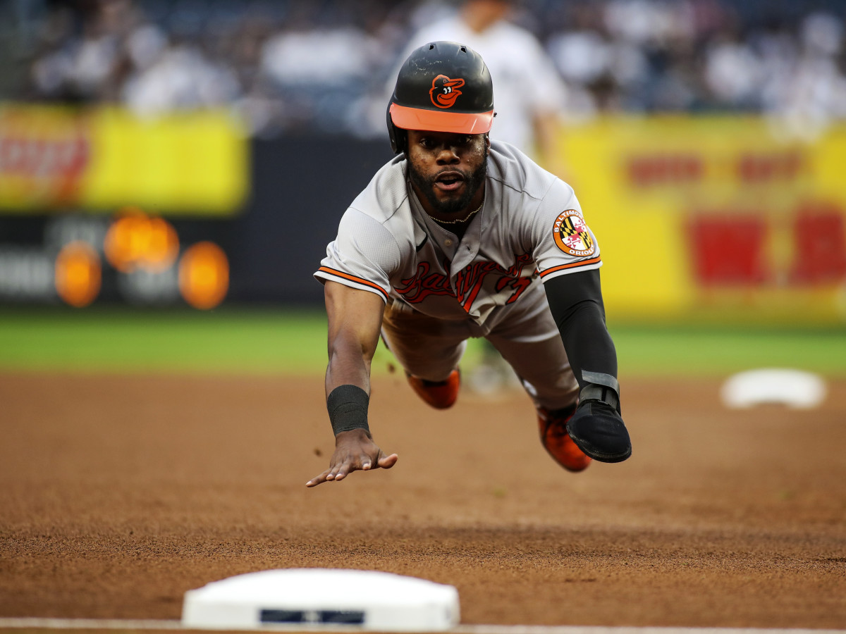 Aug 4, 2021; Bronx, New York, USA; Baltimore Orioles center fielder Cedric Mullins (31) slides into third base in the first inning against the New York Yankees at Yankee Stadium.