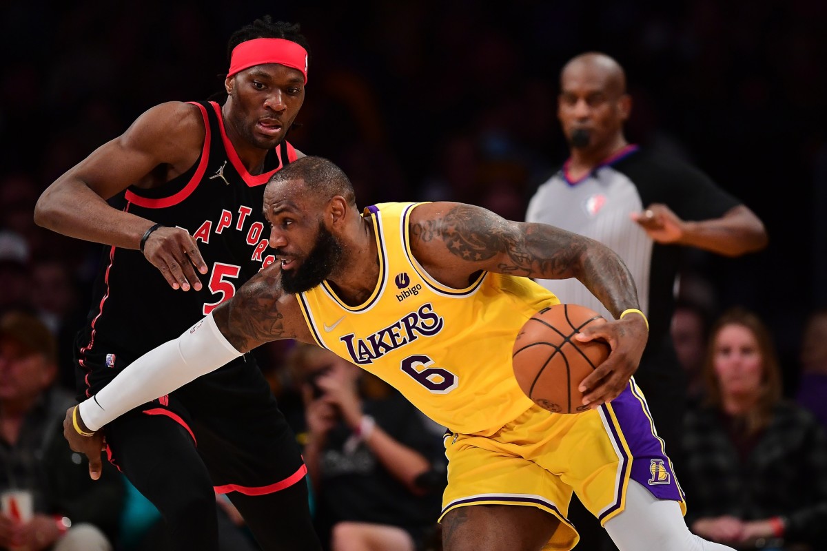 Los Angeles Lakers forward LeBron James (6) moves to the basket against Toronto Raptors forward Precious Achiuwa (5) during the first half at Crypto.com Arena