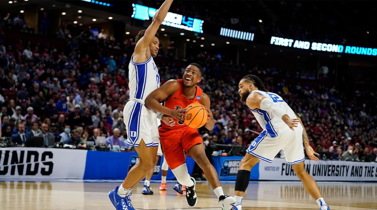 Cal State Fullerton’s Jalen Harris (0) drives the ball to the basket during the second half of a college basketball game in the first round of the NCAA tournament against Duke, Friday, March 18, 2022, in Greenville, S.C.