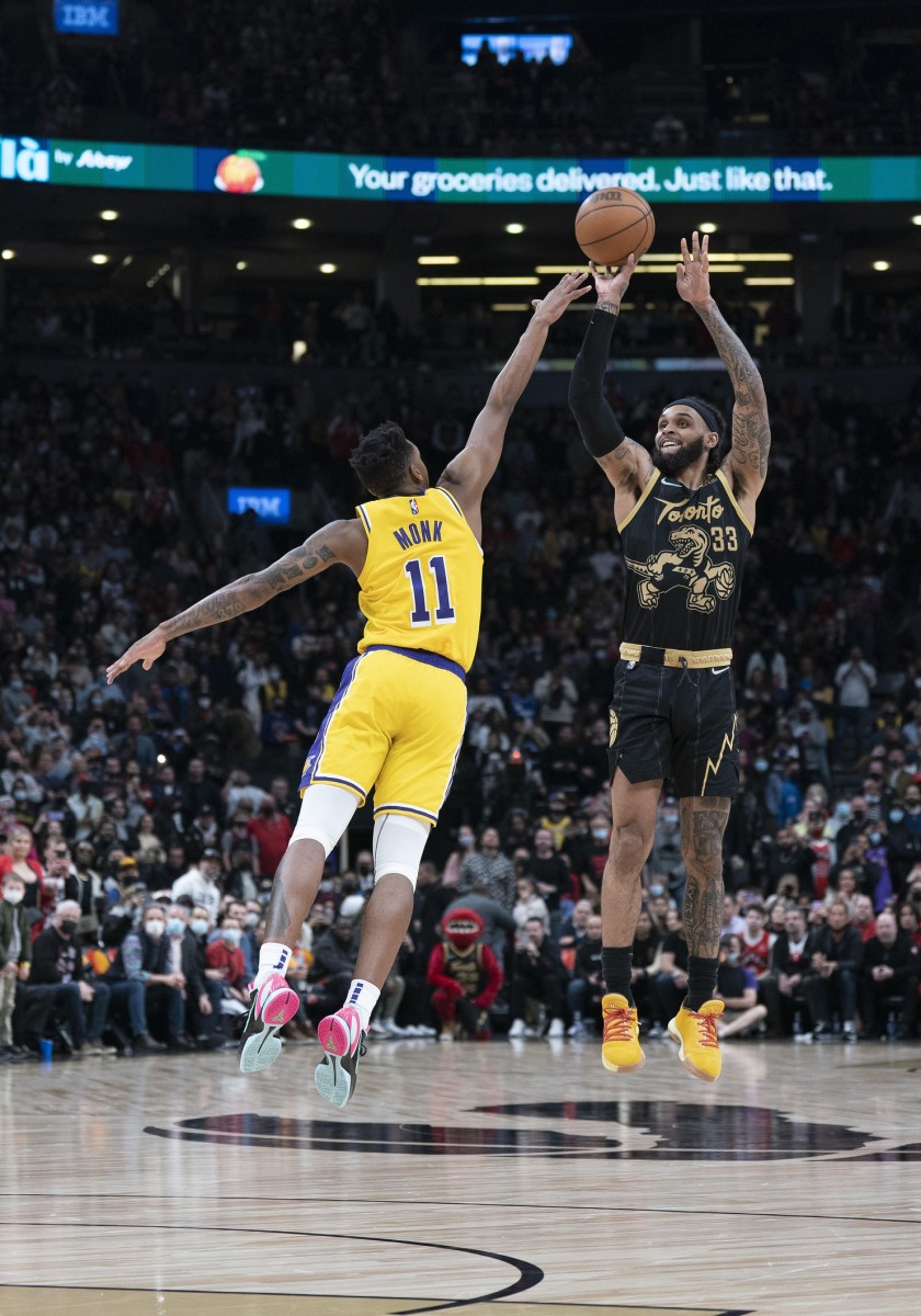 Toronto Raptors guard Gary Trent Jr. (33) shoots a ball at the basket as Los Angeles Lakers guard Malik Monk (11) tries to defend during the fourth quarter at Scotiabank Arena